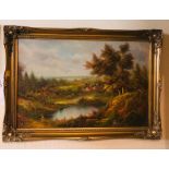 A large oil on canvas of an autumnal rural lakeside scene in large gilt frame