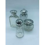 Four silver topped scent bottles