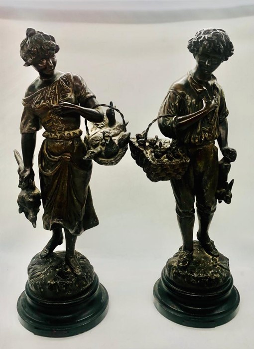 A pair of French spelter figures by George Omerth (1895-1925) titled "Heureuse Fermiere" and "Bon