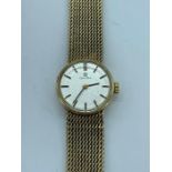 A Ladies Omega 9ct gold watch and strap.