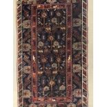 A blue and red patterned Turkish rug measuring 213cm x 123cm approx.