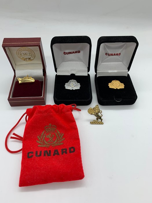 A selection of four Cunard pins.