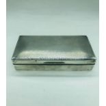 A silver cigarette box, London hallmarked