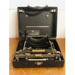 A LC Smith and Corona typewriter in original case