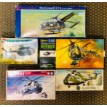 A selection of five medel helicopter kits by Airfix, Tamiya, Gelncoe models and Hasegawa
