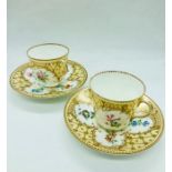 A pair of Royal Worcester teacups and saucers