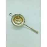 A silver hallmarked tea strainer