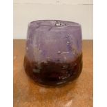 A large hand blown glass vase in two tones of purple with air bubble effect