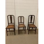 Three mahogany chairs with cane seats