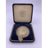 A 1939 silver long jump medal