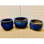 Three low blue glazed garden pots, larger one approx. 50cm x 30cm