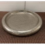 A contemporary hammered large plate