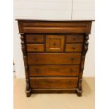 A mahogany tall chest of drawers with scroll detail to sides (D=W105cm H130cm D44cm)