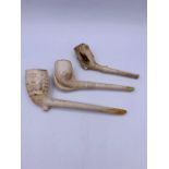 Three clay pipes