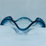 A Low Wave glass vase with a blue/grey rim
