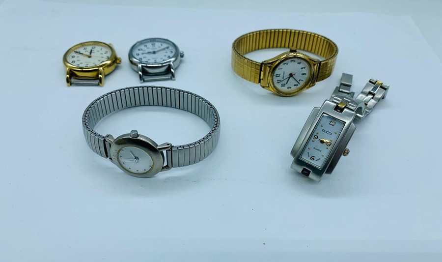 A Small number of ladies watches including one by Gucci