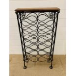 A wrought iron wine rack