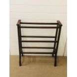 A substantial wooden towel rail