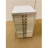 A small metal ten drawer filing cabinet