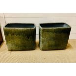 A pair of two glazed ceramic plant pots
