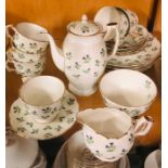 An Aynsley lilac Thistle tea set to include six cups and saucers, a tea pot, sugar bowl, milk jug