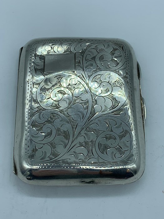 A hallmarked silver cigarette case, vintage cigarettes included!!.