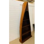 A wooden boat bookcase