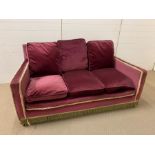 A three seater velvet sofa