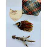 Two Scottish brooches to include a Grouse Claw on silver mounts.