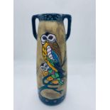 A stoneware two handled jug with owl design