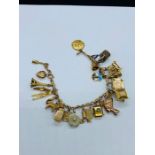 A 9 ct gold charm bracelet (42.5 total weight)