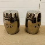 A pair of metallic oriental ceramic stools