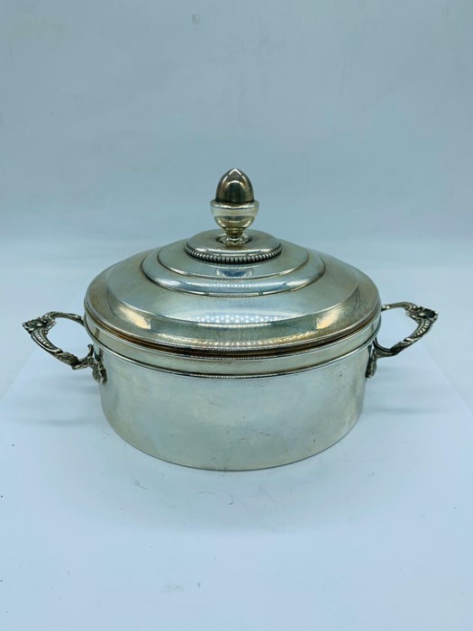 A continental silver two handled glass lined and lidded dish.