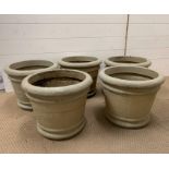 A set of five plastic garden pots