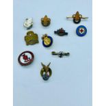 A small collection of vintage badges to include Girl Guides and Boy Scouts.