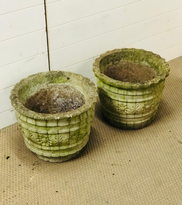 A pair of weathered stone garden planters (H31cm diameter 41cm)