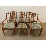 A set of six Sheraton style dining chairs, with carved and pierced slats and square tapering legs