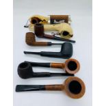 A selection of eight collectable pipes one with an 18 K gold mount.