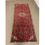 A Persian rug runner from the Estate of Sheikh Mustafa Edrees