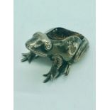 A hallmarked silver pin cushion in the form of a frog AF