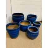 A selection of six blue glazed garden pots various sizes