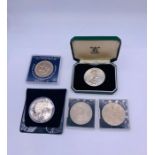 A collection of Commemorative coins including one silver