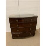 A chest of drawers two over three with foliate brass handles