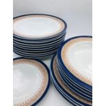 A selection of Royal Worcester Vitreous in cobalt blue and taupe to include ten large shallow bowls,