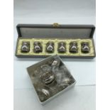 Boxed sets of Six Japanese Silver Pepper pots an salts.