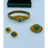A Persian yellow gold jewellery set with turquoise to include bangle, earrings and mourning style