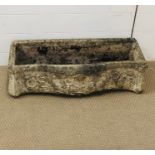 A weathered stone garden trough (74cm x 31cm)