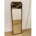 A full length walnut framed mirror