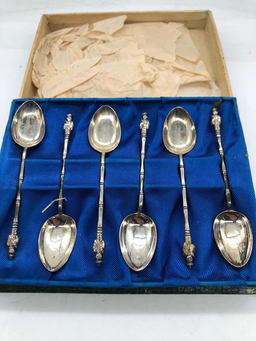 A boxed set of silver spoons marked 950.