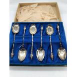 A boxed set of silver spoons marked 950.